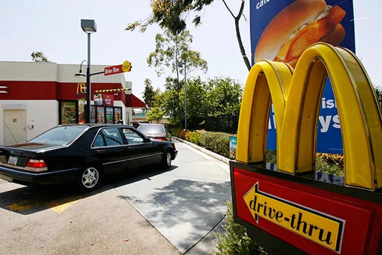 Cars enter the drive thru at a McDonald's in El Segundo, Calif. (AP Photo/Nick Ut)