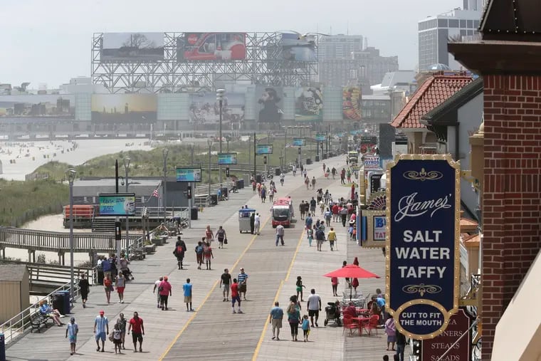 Visitors stroll along the Boardwalk in Atlantic City in 2017.