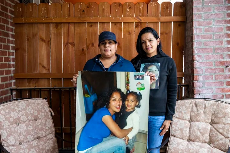 Christina "Tina" Ray, 43, left, and Frances "Mia" Casteing, 34, hold a photo of their sister Franchesca Alvarado with her daughter Janiah, then 3, on Wednesday, June 2, 2021. Franchesca went missing in March 17, 2012, after a trip to Atlantic City. Eighteen months later, her sneaker washed up on the shore. Throughout the years they’ve come across more body parts of their sister. “I just want to give awareness to people, and that monsters are real, and they look like us,” Christina said. “Everyday I pray for family members that get nothing. There are people who have been missing and nothing has been found.”