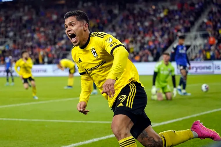 Columbus Crew forward Cucho Hernández celebrates after teammate Christian Ramirez's game-winning goal late in extra time.