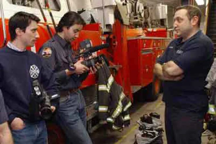 CBS's rebroad- cast of &quot;9/11&quot; features (from left) firefighter James Hanlon (not seen), filmmakers Gedeon and Jules Naudet,firefighter Joe Casaliggi.
