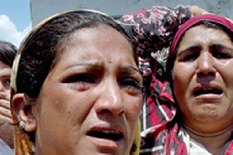 Women mourn after a bombing in Matta, Pakistan, in the Swat region on the Afghan border. Pakistani forces have been massing in the region.