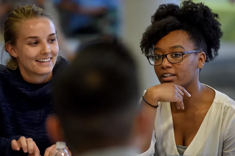 Drexel University Public Health students Tori Kontor (left), 23, and Cecelia Harrison (right), 23, participate in the On the Table Philly event May 23, 2017, at PMN, co-hosted by Young Involved Philadelphia (YIP). The forum is designed to engage area residents in an open dialogue, foster new relationships and inspire solutions to strengthen communities.