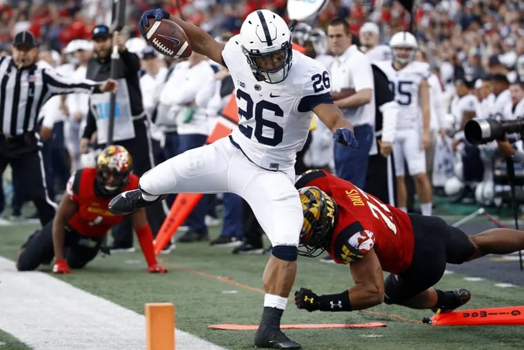 Penn State Nittany Lions running back Saquon Barkley (26) rushes out of bounds during the first half of Saturday’s 66-3 win at the Maryland Terrapins.
