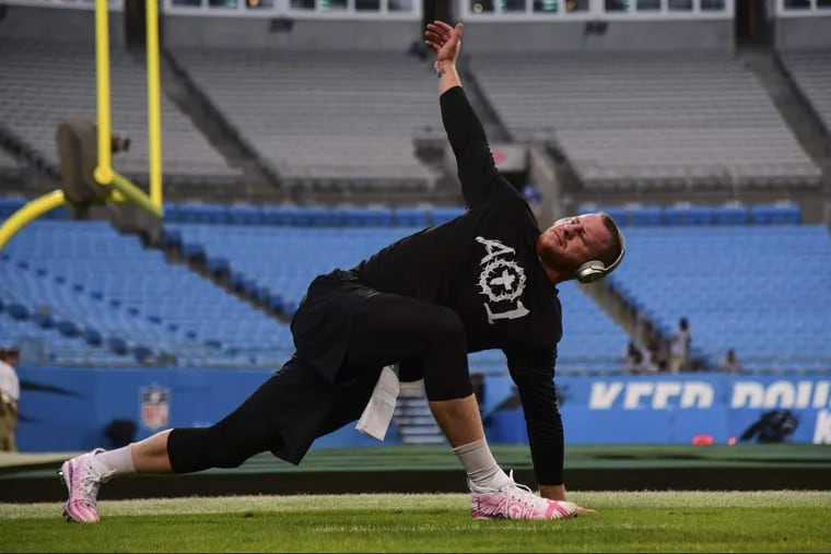 Philadelphia Eagles quarterback Carson Wentz warms up at Bank of America Stadium in Charlotte, N.C., ahead of the Eagles’ Thursday night game at the Carolina Panthers.