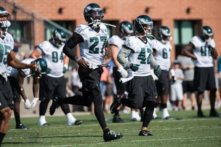 Philadelphia Eagles safety Malcolm Jenkins (27) runs next to teammate Chris Maragos (42) during during last year’s training camp at the NovaCare Complex.