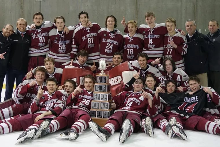 St. Joseph’s Prep celebrates beating Holy Ghost Prep for its first Flyers Cup championship.