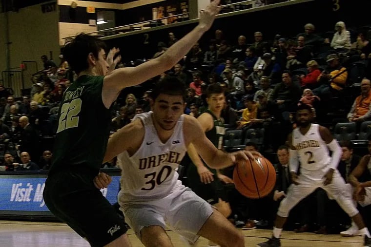Drexel's Alihan Demir drives baseline on William and Mary’s Paul Rowley
