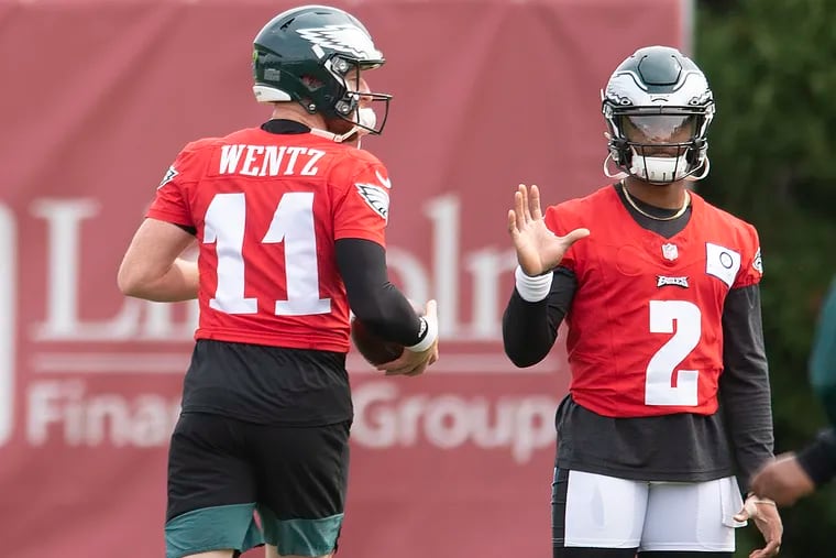 The Eagles' struggling quarterback Carson Wentz (11), and his rookie backup Jalen Hurts are under heavy scrutiny after an 0-2 start.