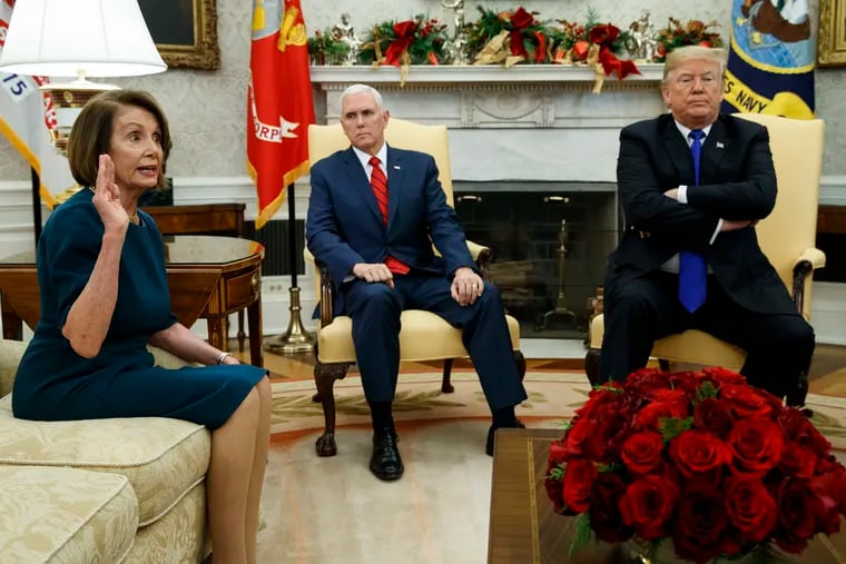 Vice President Mike Pence, center, listens as President Donald Trump argues with then-House Minority Leader Nancy Pelosi during a meeting in the Oval Office of the White House in 2018.