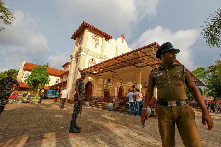 Sri Lankan army soldiers secure the area around St. Sebastian's Church damaged in blast in Negombo, north of Colombo, Sri Lanka, Sunday, April 21, 2019.