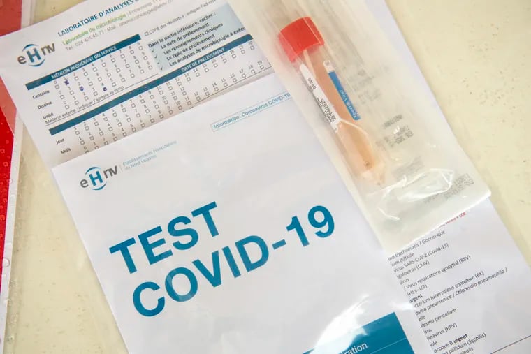 A Covid-19 test is ready to be send to a laboratory after a medical worker took a swab at a drive-in coronavirus testing facility in front of the 'eHnv' (Etablissements Hospitaliers du Nord Vaudoi) hospital in Yverdon-les-Bains, Switzerland, Thursday, April 30, 2020. Countries around the world are taking increased measures to stem the widespread of the SARS-CoV-2 coronavirus which causes the Covid-19 disease. (Laurent Gillieron/Keystone via AP)