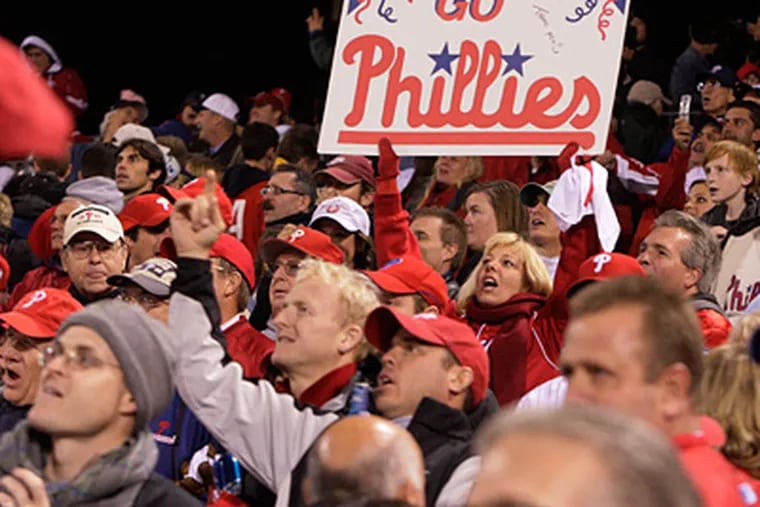 Fans sing 'High Hopes' after the Phillies beat the Yankees 8-6 in Game 5 of the World Series. (Elizabeth Robertson / Staff Photographer)