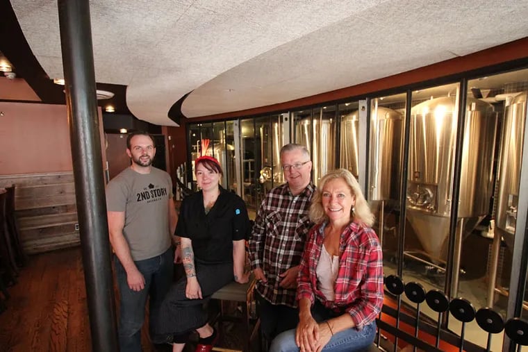 The crew at 2nd Story Brewing Co. (from left): Brewer John Wible, chef Rebecca Krebs, general manager Ken Merriman and owner Debbie Grady. (MICHAEL KLEIN / Philly.com)