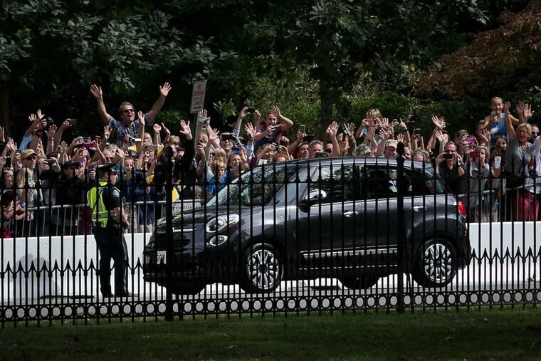 Pope Francis arrives in his Fiat to Saint Charles Borromeo Seminary in Wynnewood as spectators cheer on Sept. 26, 2015. ( ALEJANDRO A. ALVAREZ / Staff Photograher )