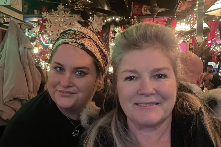 Haley Burke, a server at McGillin's Olde Ale House, (left) with actress Kate Mulgrew in December 2022 when Mulgrew came to McGillin's while researching local accents.