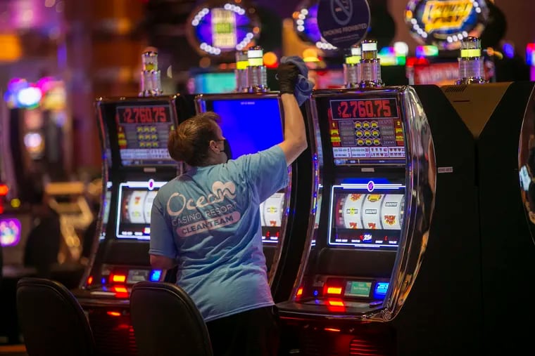 A member of the Ocean Casino Resort, Clean Team wipes down slot machines. Atlantic City is preparing to reopening its casinos during mandatory shutdown during Covid-19 pandemic. The casino resort will open July 2, at 25% capacity.