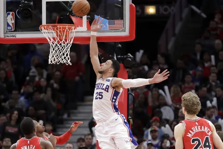 Sixers guard Ben Simmons rises up for a tip-in off a pass from Joel Embiid in the team’s 116-115 win over the Bulls on Thursday.