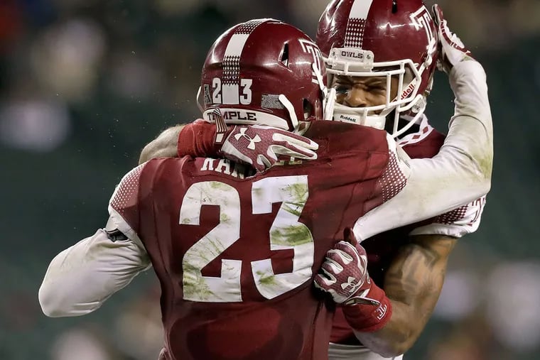 Temple defensive back Delvon Randall (No. 23) celebrates his fourth-quarter interception with defensive back Nate L. Smith against USF on Friday, Oct. 21, 2016 in Philadelphia.
