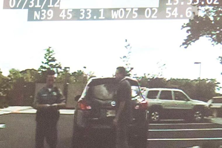 A still from police footage of Assemblyman Paul Moriarty's alleged false arrest. Officer Joseph DiBuonaventura is on the left.