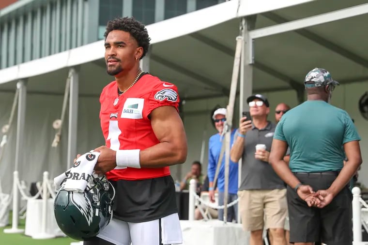 Quarterback Jalen Hurts (1) enters for his first day of training camp open to the public and media at the NovaCare Complex in South Philadelphia on Wednesday, July 27, 2022