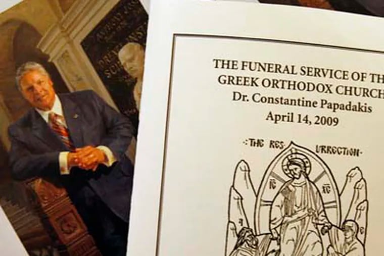 Funeral program for the memorial service for Drexel President Constantine Papadakis at St. Lukes Greek Orthodox Church in Broomall this afternoon.  (Elizabeth Robertson / Staff Photographer)