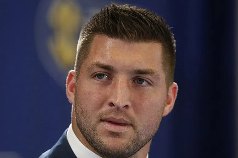 FILE - In this Dec. 5, 2014, file photo, Tim Tebow speaks during an SEC television broadcast in Atlanta. (AP Photo/Brynn Anderson, File)