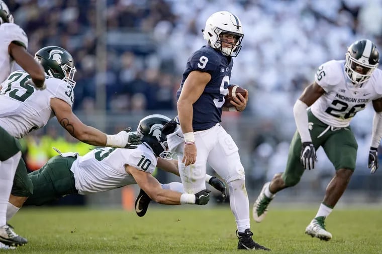 Penn State quarterback Trace McSorley, here getting taken down by Michigan State, has been running the ball more often lately.