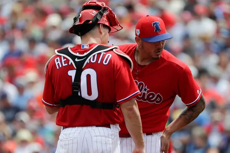 Phillies catcher J.T. Realmuto meets with pitcher Vince Velasquez during the second-inning against the Tampa Bay Rays in a spring training game on Monday, March 11, 2019 at Spectrum Field in Clearwater, FL.  Velasquez gave up four runs in the inning.