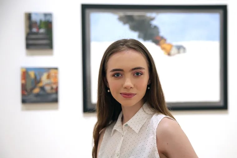 Soleil Hawley poses with some of her art at Pennsylvania Academy of the Fine Arts in Philadelphia on May 30, 2019.  At 18, Hawley is on the verge of getting her bachelor's degree in fine arts from the University of Pennsylvania. She took her first college class at age 11.