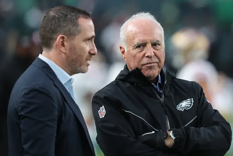 Philadelphia Eagles general manager Howie Roseman (left) and Philadelphia Eagles owner Jeffrey Lurie (right) talk before the Eagles play the 49ers at Lincoln Financial Field last season.