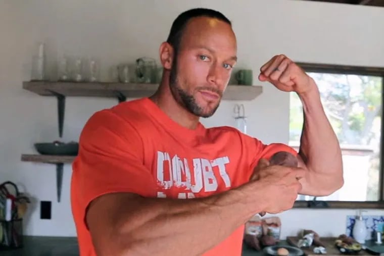 New Phillies manager Gabe Kapler showing off his muscles during a segment on Fox Sports.