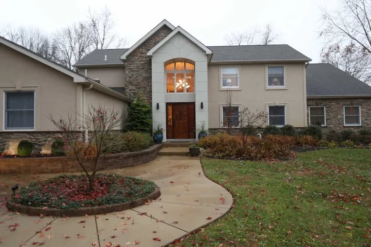 The exterior of the Gross home in Moorestown, which has a passive solar system and a collection of Hanukkah menorahs.