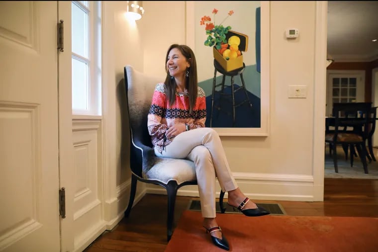 Marta Adelson, an art collector in Merion Station, has been an organizer — and customer — of the Philadelphia Museum of Art Craft Show. Her foyer has a painting by Daniel Heyman, who has work is in the Art Museum's collection.
