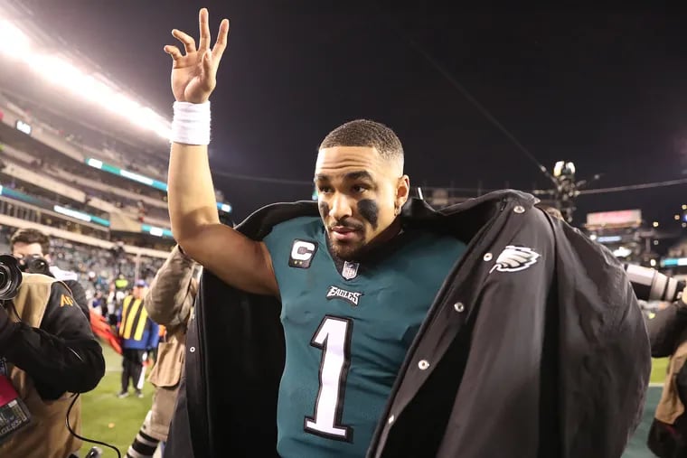Eagles quarterback Jalen Hurts waves to the crowd Saturday after the team's 38-7 victory over the Giants in the NFC divisional round.