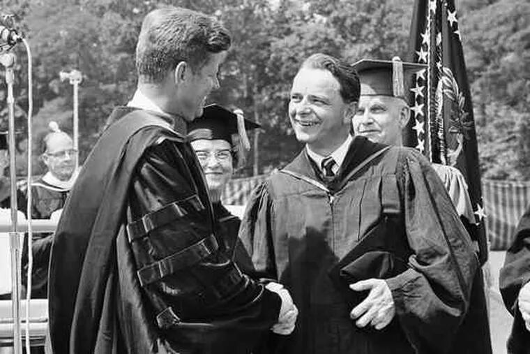 In this June 1963 photo, President John F. Kennedy shakes hands with Sen. Robert C. Byrd at American University's graduation. Kennedy got an honorary doctor of law degree.