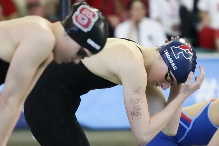 Penn’s Lia Thomas has “let trans kids play” written on her arm before racing in the 100-yard freestyle final at the NCAA women's swimming and diving championship in Atlanta on March 19.
