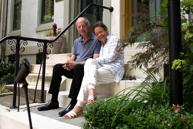 Michael and Marta Silverberg sit on the front steps of their historic home in Fairmount, Philadelphia. The home still retains numerous features original to the space which was built in 1876 in time for the city’s Centennial Celebration.