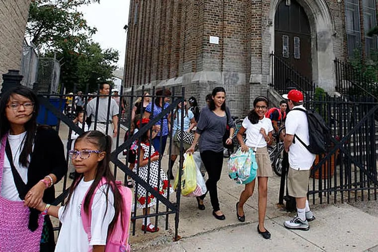 Dismissal time on the first day of school at William M. Meredith Elementary in Queen Village. The district struggled to open this week. (YONG KIM / Staff Photographter)