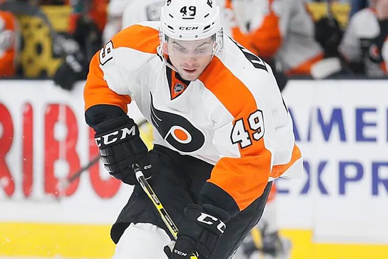Philadelphia Flyers center Scott Laughton skates with the puck against the Los Angeles Kings during the third period of an NHL hockey game, Saturday, Dec. 6, 2014, in Los Angeles. (Danny Moloshok/AP)