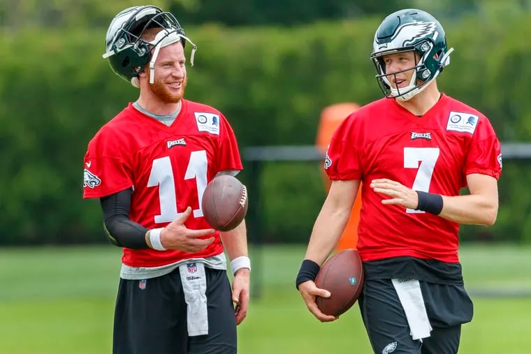 Nate Sudfeld, right, and Carson Wentz, left, share a moment during the Eagles' spring OTAs. With Nick Foles gone, Sudfeld is expected to be the oft-injured Wentz's backup this season.