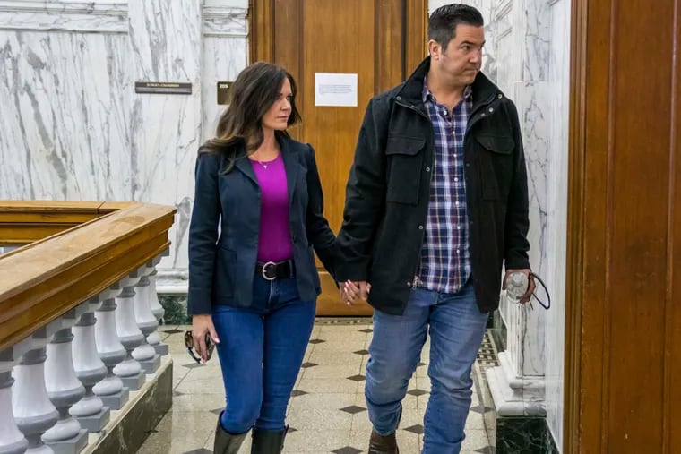 Republican Senate candidate Sean Parnell, right, walks to a courtroom with his girlfriend Monday at the Butler County Courthouse for the second day of his child custody trial. Under oath he flatly denied his estranged wife's claims of abuse. (Andrew Rush/Pittsburgh Post-Gazette via AP)