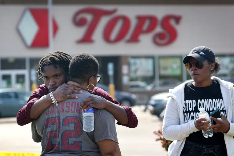 People gathered outside of Tops market embrace on May 15 in Buffalo, New York. A gunman opened fire at the store over the weekend, killing ten people and wounding another three.
