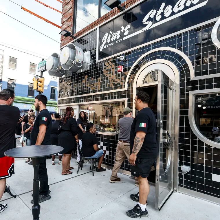 A scene not seen since July 2022: A crowd around Jim's Steaks at Fourth and South Streets. A preopening party Monday helped test the kitchen before the opening Wednesday.
