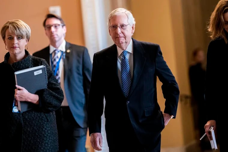 Senate Majority Leader Mitch McConnell walks back to the Senate floor after a break during the Senate Impeachment trial of President Donald Trump on Capitol Hill in Washington on Wednesday January 22, 2020.