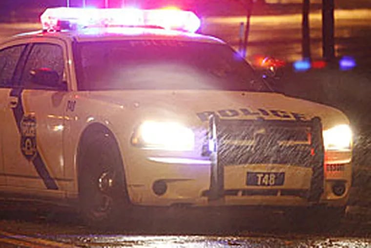 File Photo: Philadelphia police car at night.