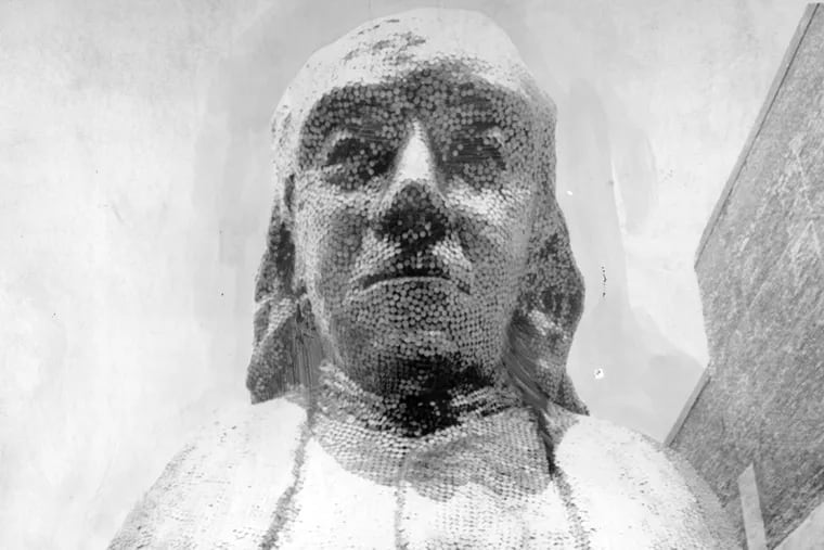 The fiberglass bust of Benjamin Franklin covered with 80,000 pennies collected from Philadelphia school children is seen in this 1971 file photo.