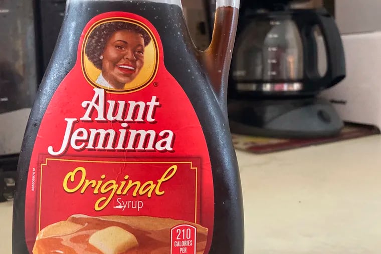 A bottle of Aunt Jemima syrup sits on a counter. Quaker Oats company is changing the name and marketing image of the 131-year-old Aunt Jemima pancake mix and syrup.