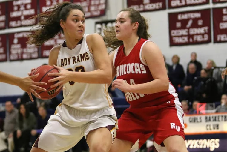 Gloucester Catholic's Mary Gedaka, left, is defended by Rancocas
Valley's Katie McShea during a game Friday, February 12, 2016.