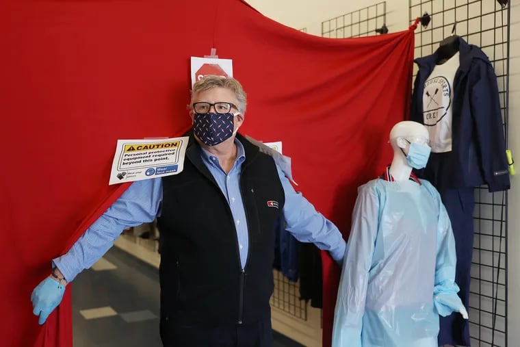 Founder and CEO John Strotbeck stands for a portrait at the entrance to the Boathouse Sports factory. The company, which normally manufactures custom sports apparel, has switched to making personal protective equipment.